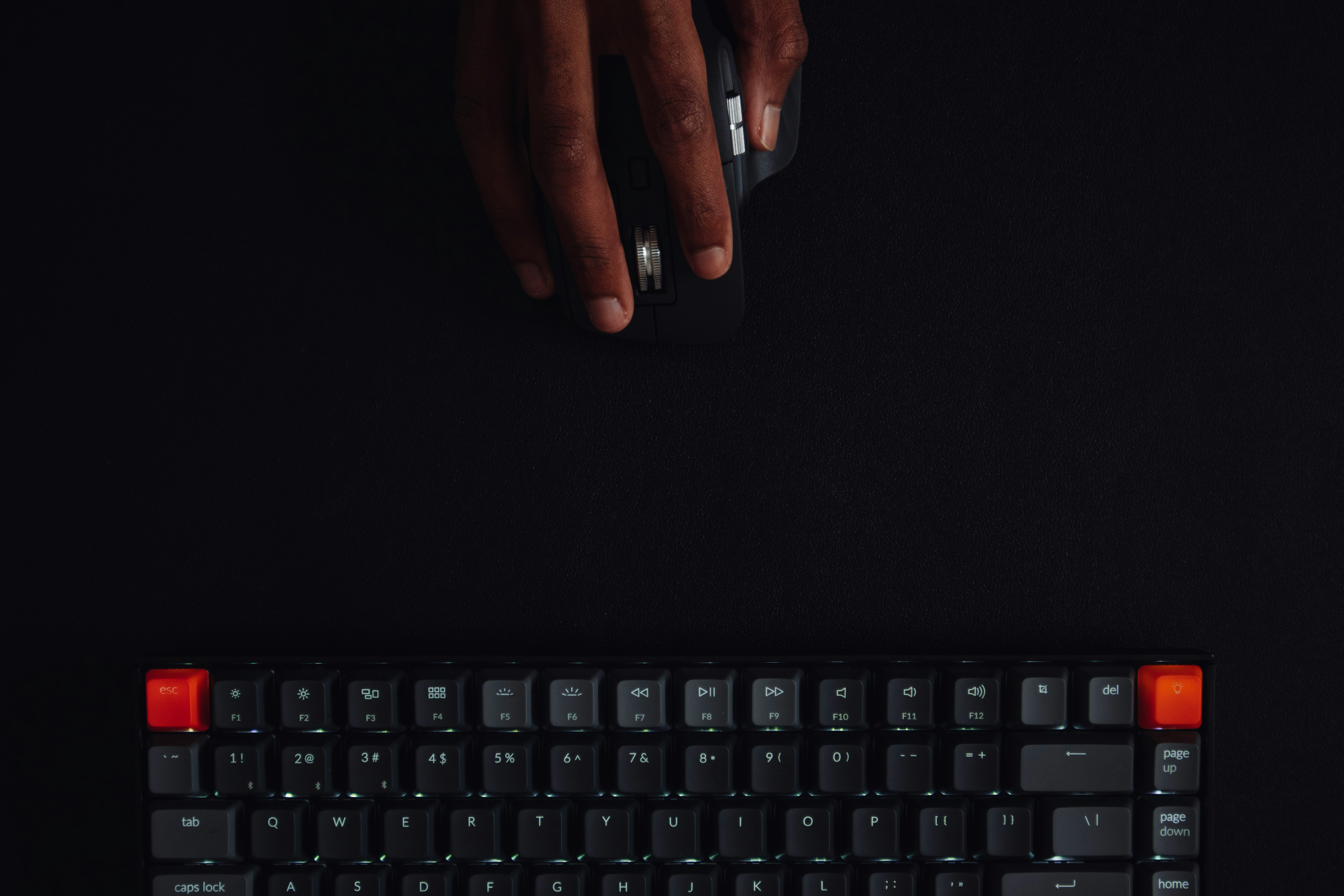 persons hand on black computer keyboard